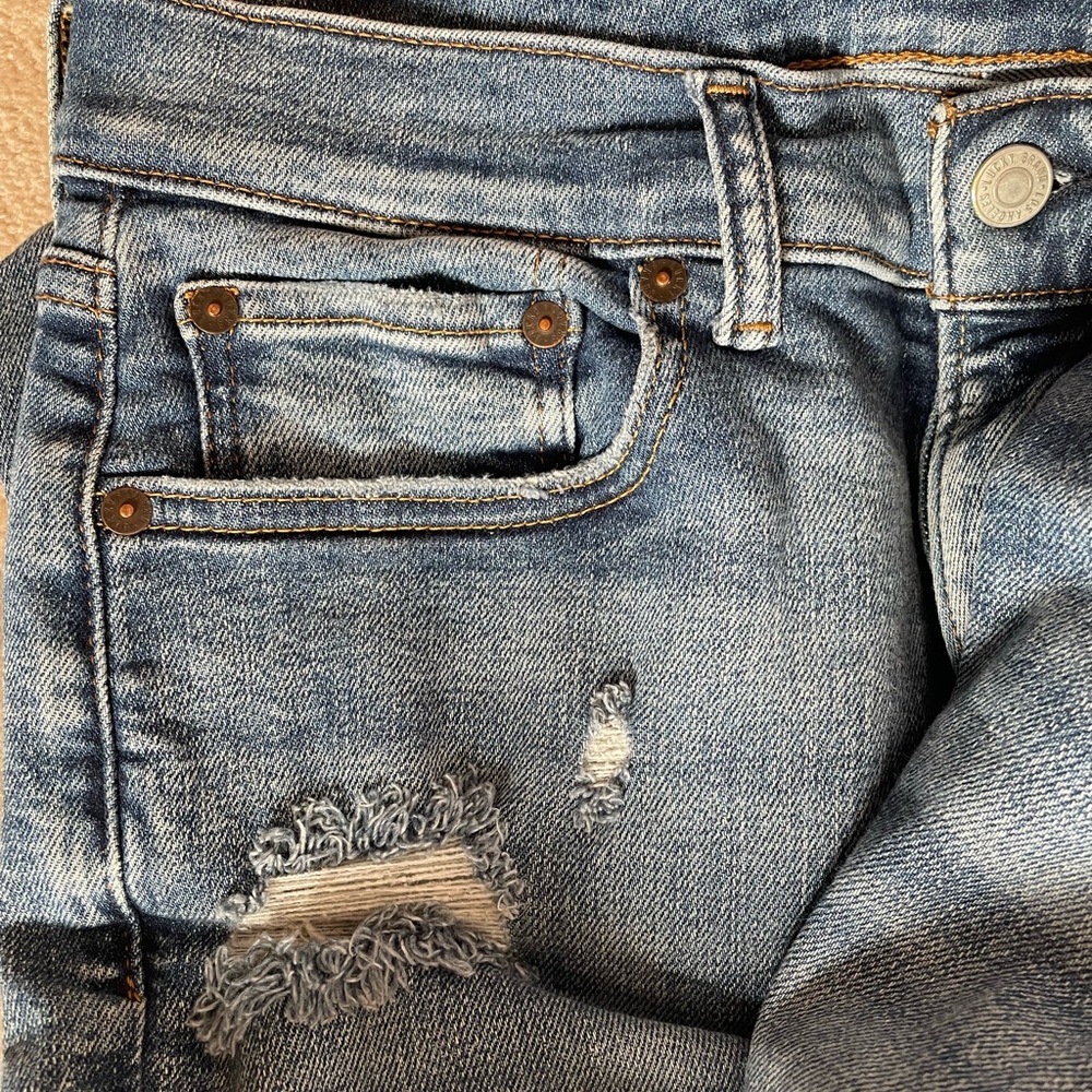 Distressed Blue Jeans